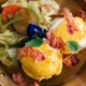 Scrumptious egg Benedicts for a delightful breakfast at BLISS Restaurant Siargao - A perfect blend of poached eggs, savory ham, and hollandaise sauce, creating a breakfast masterpiece to start your day right.