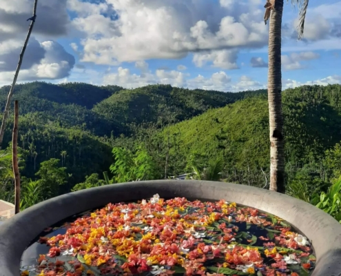 Kawa Hot Bath at Canijugan Peak: A unique and relaxing experience where visitors can unwind in a large, traditional Filipino cauldron bath surrounded by the natural beauty of Siargao's lush landscape.